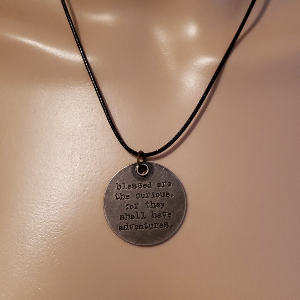 Antiqued Curious adventure message on black cord